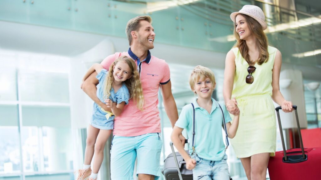 Smiling family with children at the airport. Travel Concept