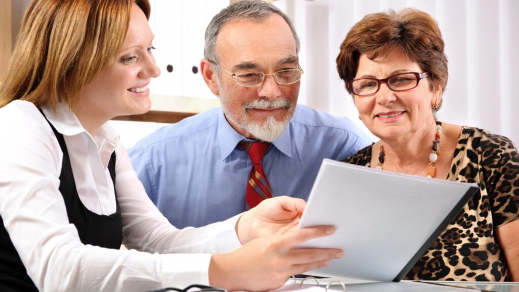 Senior couple meeting with financial advisor. Money Concept