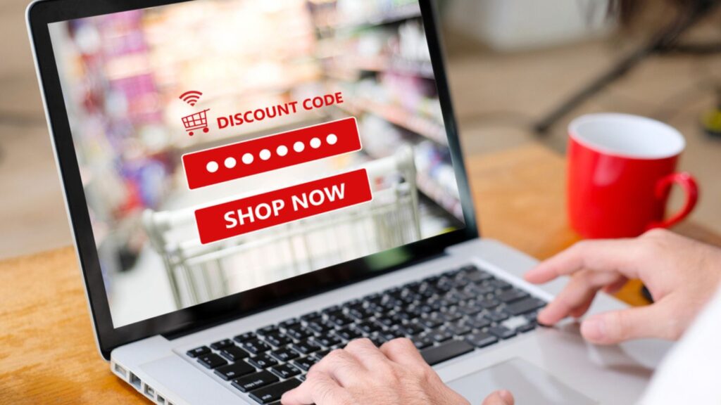 E-coupon, Grocery shopping online, Woman hand using laptop computer entering the discount coupon code on screen, online shopping sale