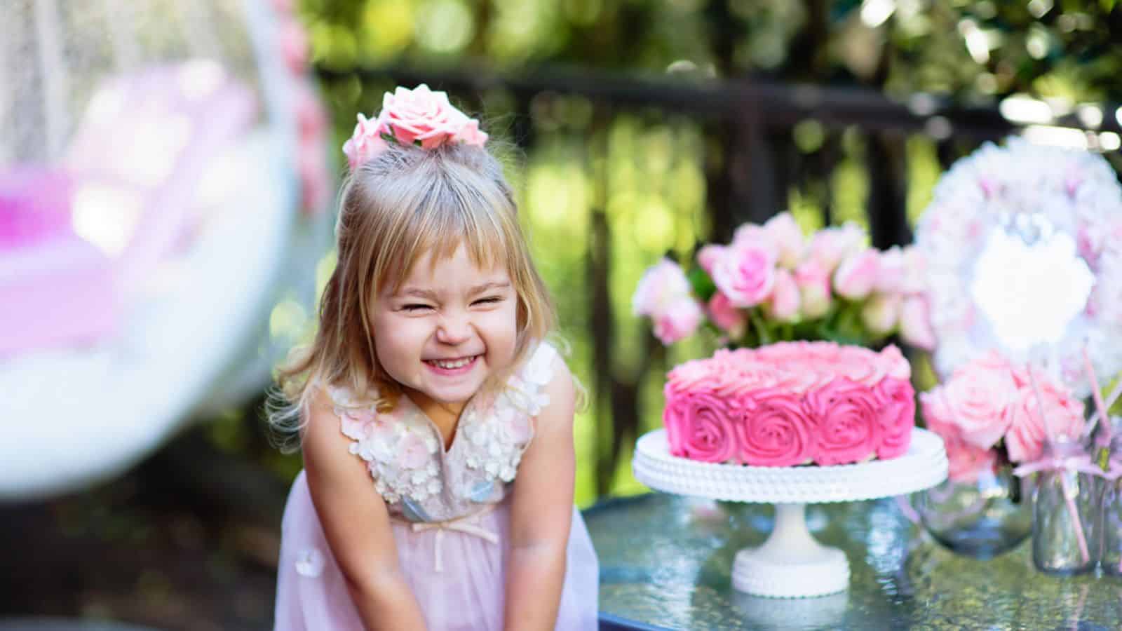 Little girl celebrate Happy Birthday Party with rose outdoor