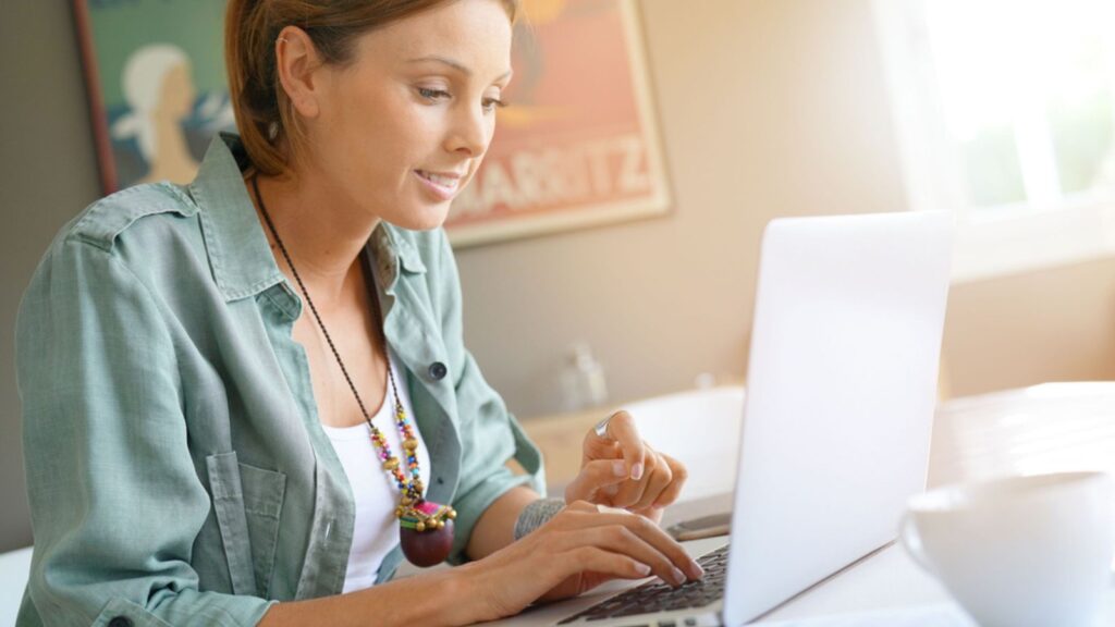 Woman at home working on laptop