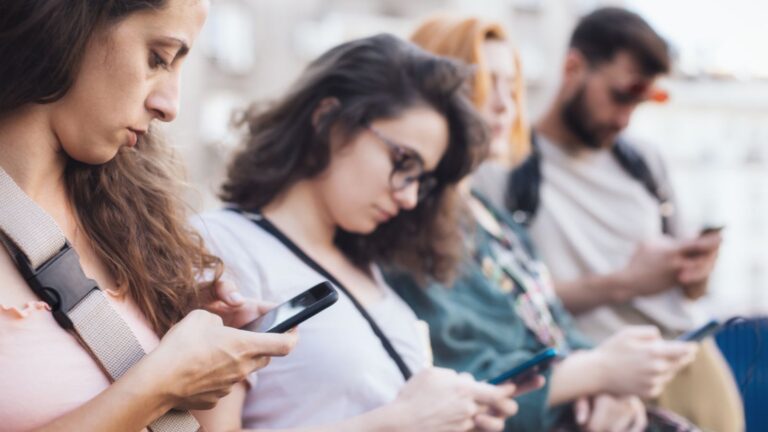 group of people on smartphone ignoring