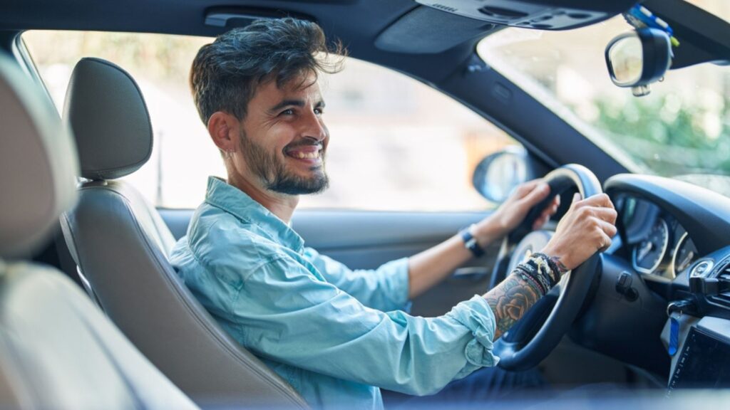 happy man driving car