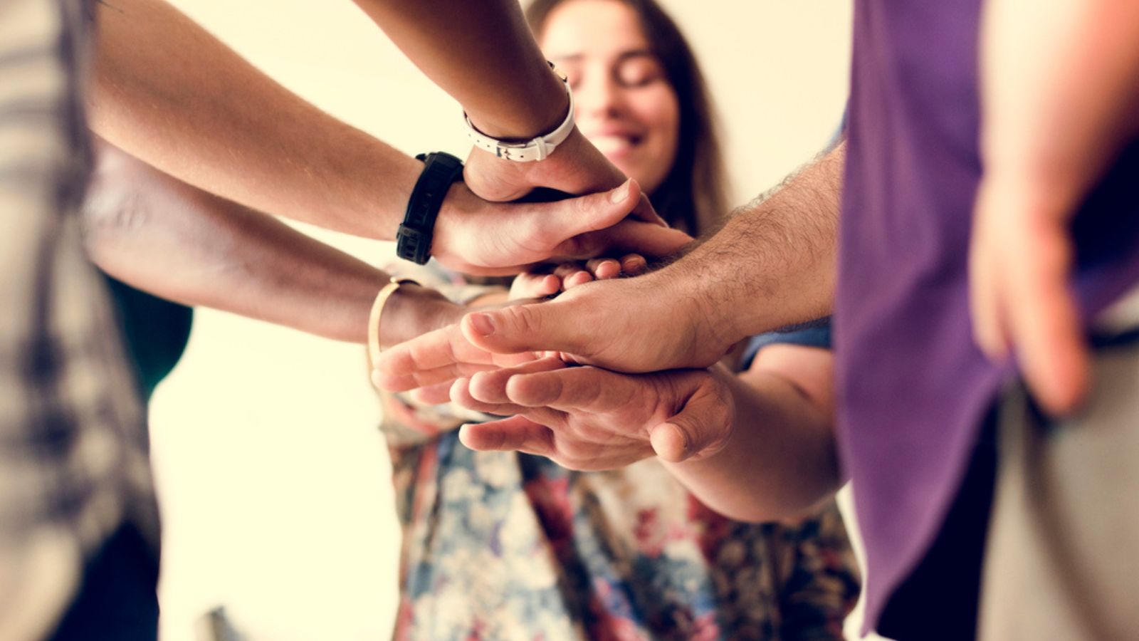 community support hand huddle